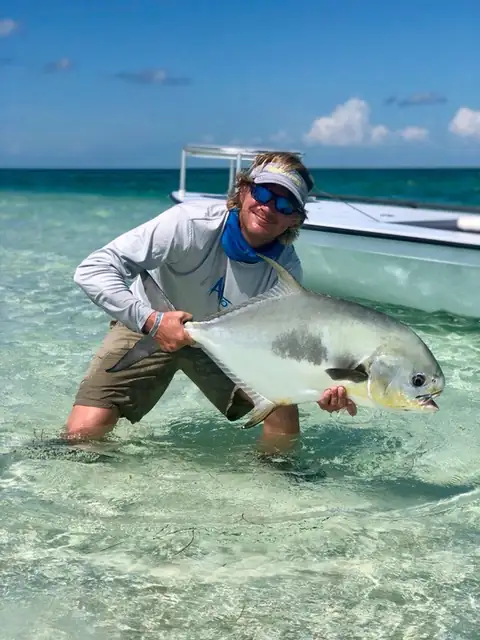 Capt. John Hoover holding a permit on the Key West flats