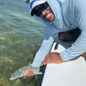Angler releasing a bonefish from the skiff on the Key West flats